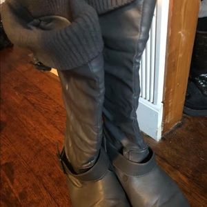 Grey boots with material.